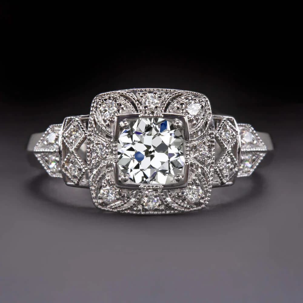 Cushion cut gemstone in vintage art deco setting with ornate metalwork