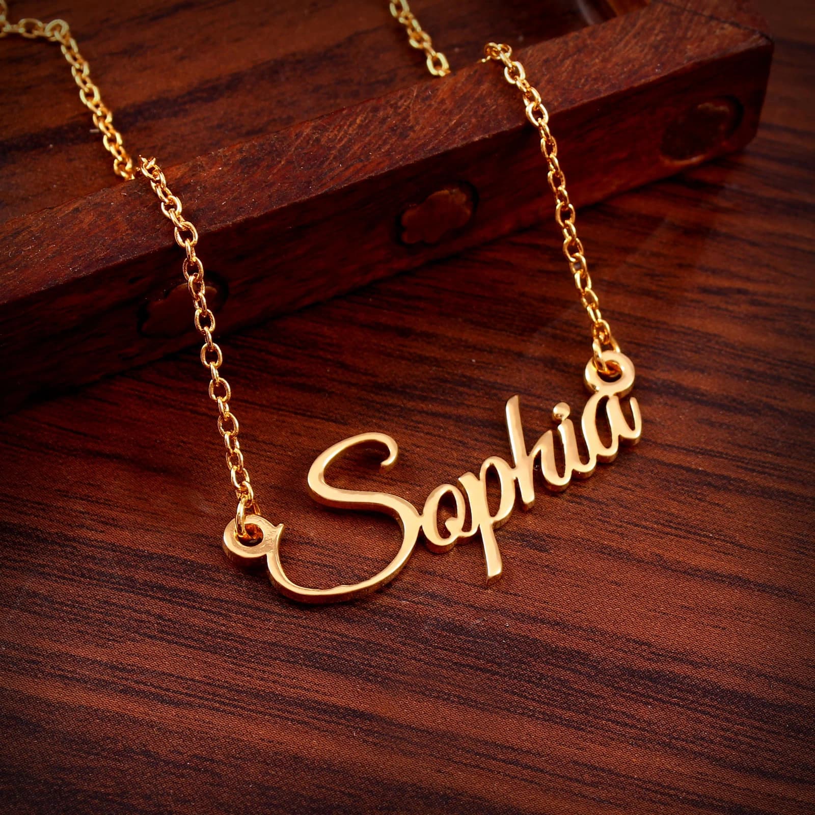 Gold script name necklace designed with AI necklace design software