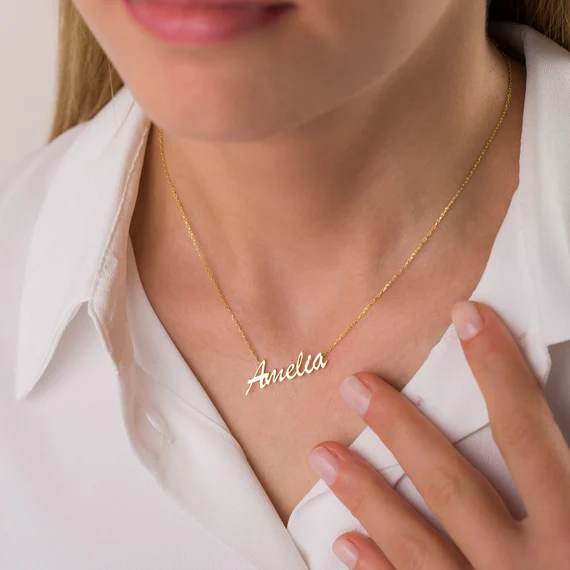 Woman wearing elegant gold script name necklace created with AI design tools
